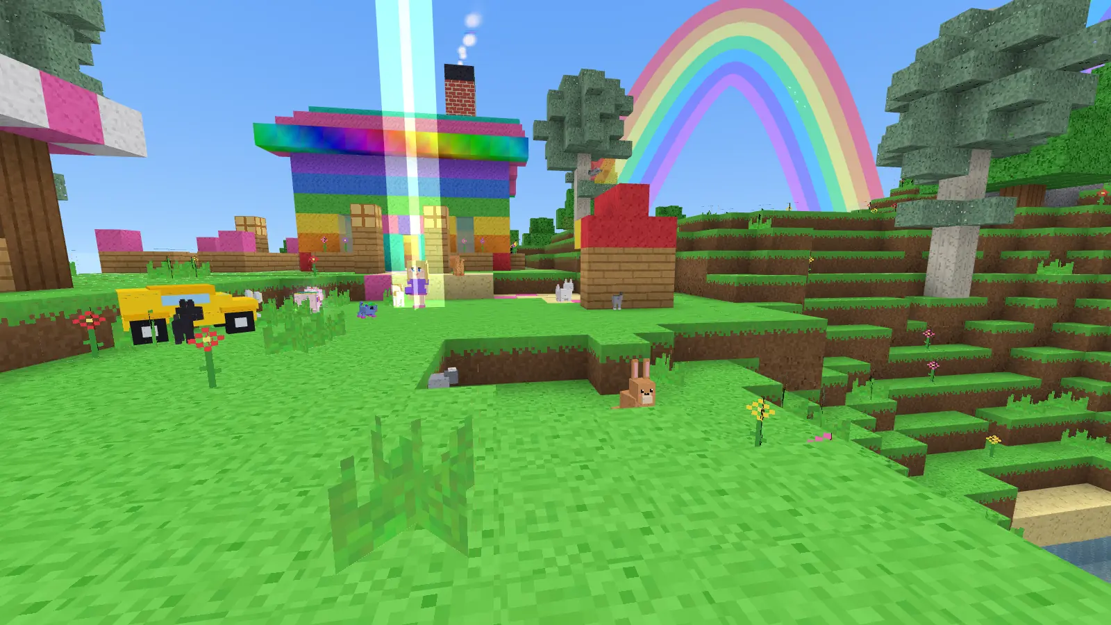 A koala, a kangaroo and a wombat standing together on the grass near the rainbow house